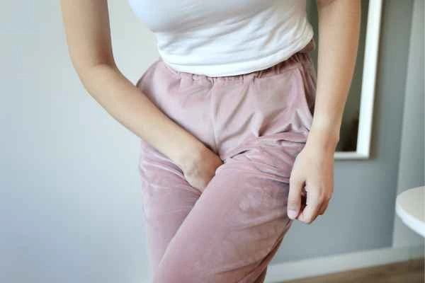 woman struggling with urine incontinence Warrington